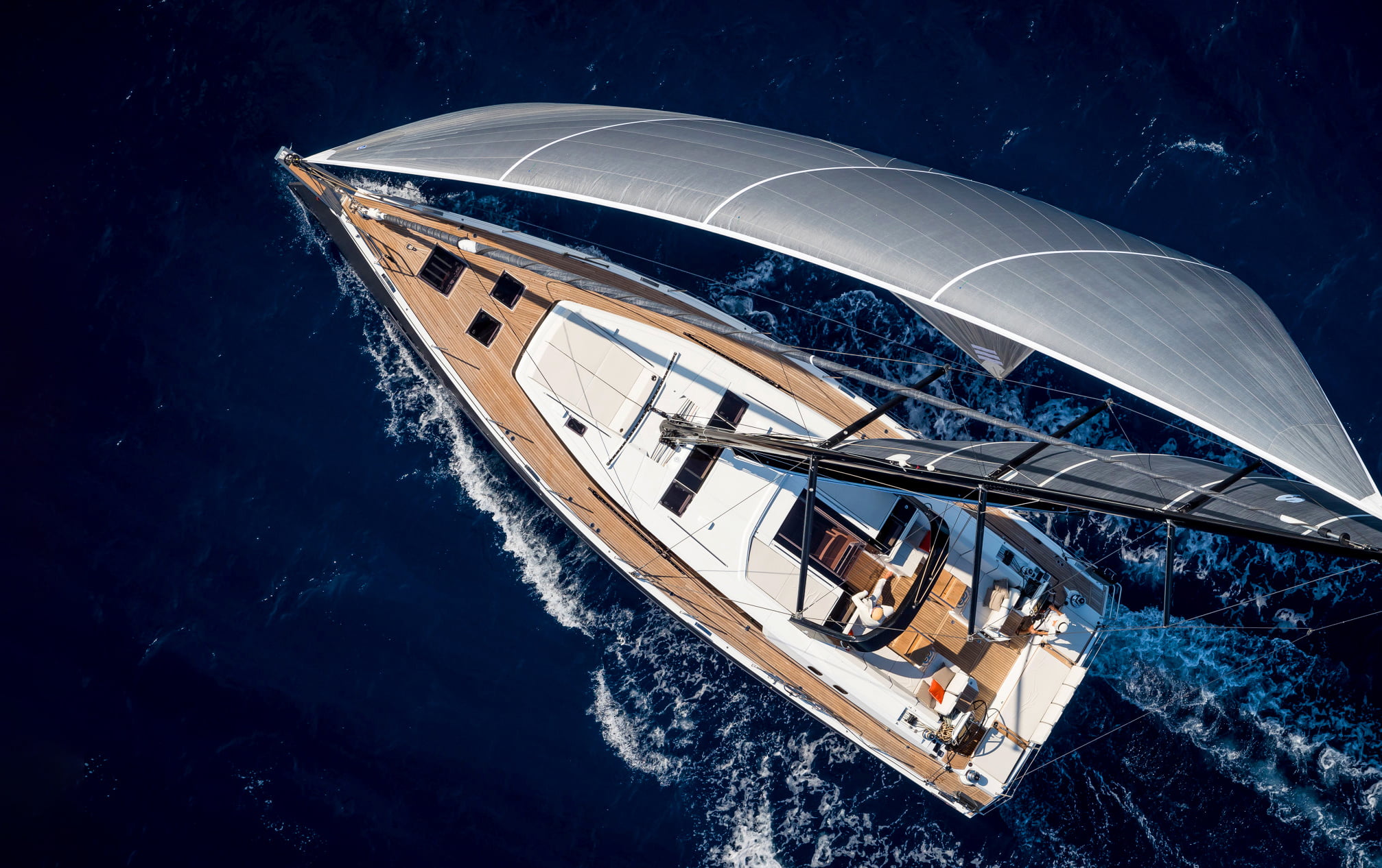 Yacht Beneteau yacht moving through the water viewed from above